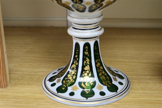 A late 19th century Bohemian white and green overlaid cut glass standing cup H24.5cm